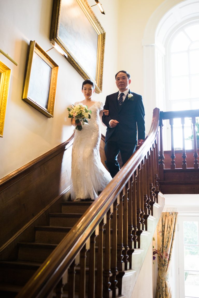 Elegant Spring Iscoyd Park Wedding. The bride wearing Liza Jane Howell wedding dress on the stairs at Iscoyd Park on the way to the ceremony.