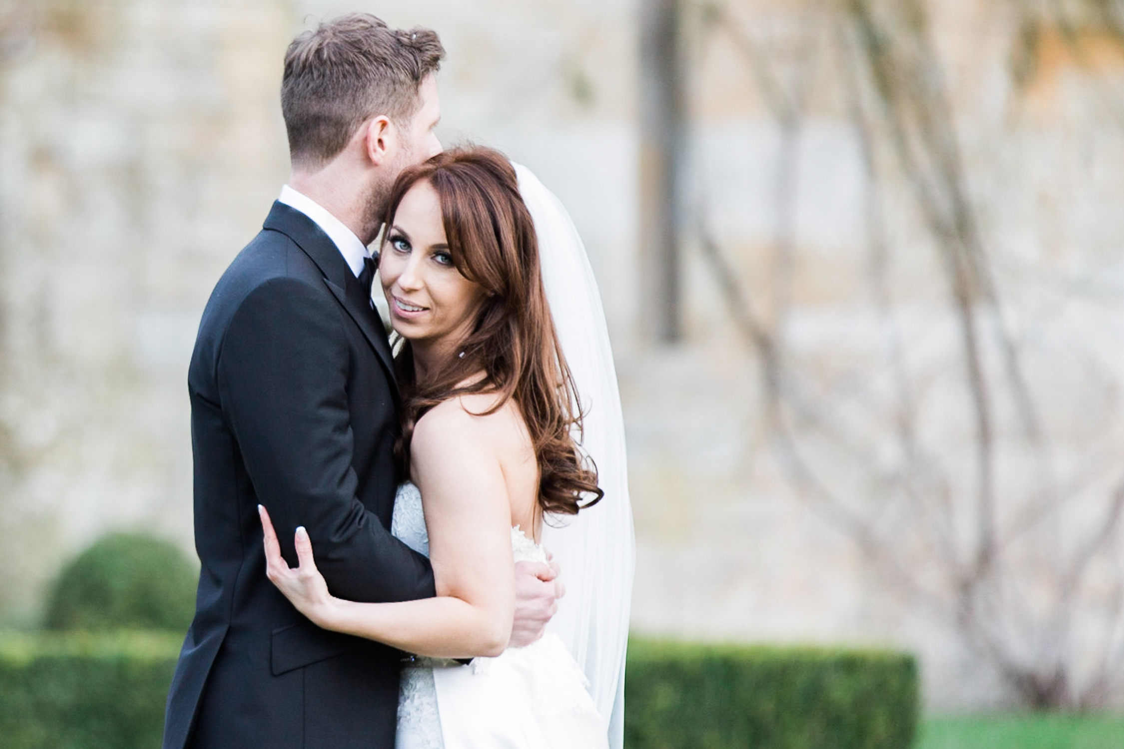 Bride wearing Suzanne Neville gown at a black tie wedding at Carlowrie Castle in Edinburgh, Scotland