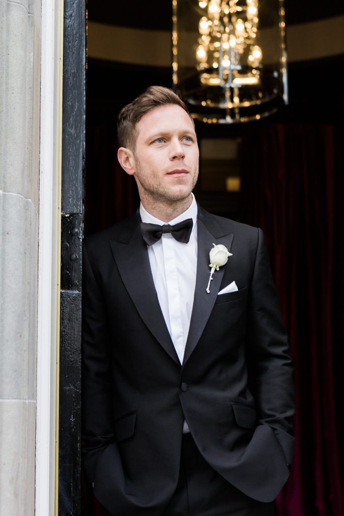 Portrait of the groom in black tie by Fine Art Wedding Photographer at Carlowrie Castle in Edinburgh, Scotland
