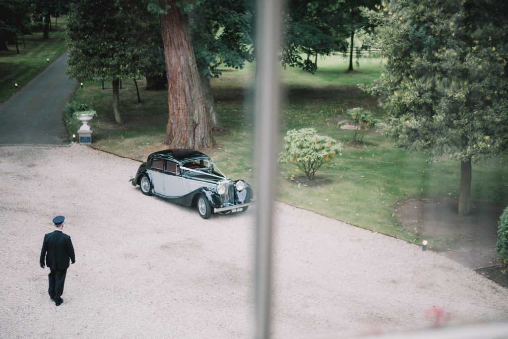 Vintage Jaguar wedding car in Edinburgh for a Scottish castle wedding at Carlowrie Castle.
