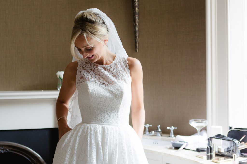 Bride wearing a Caroline Castigliano wedding dress with pockets at Carlowrie Castle Wedding photo