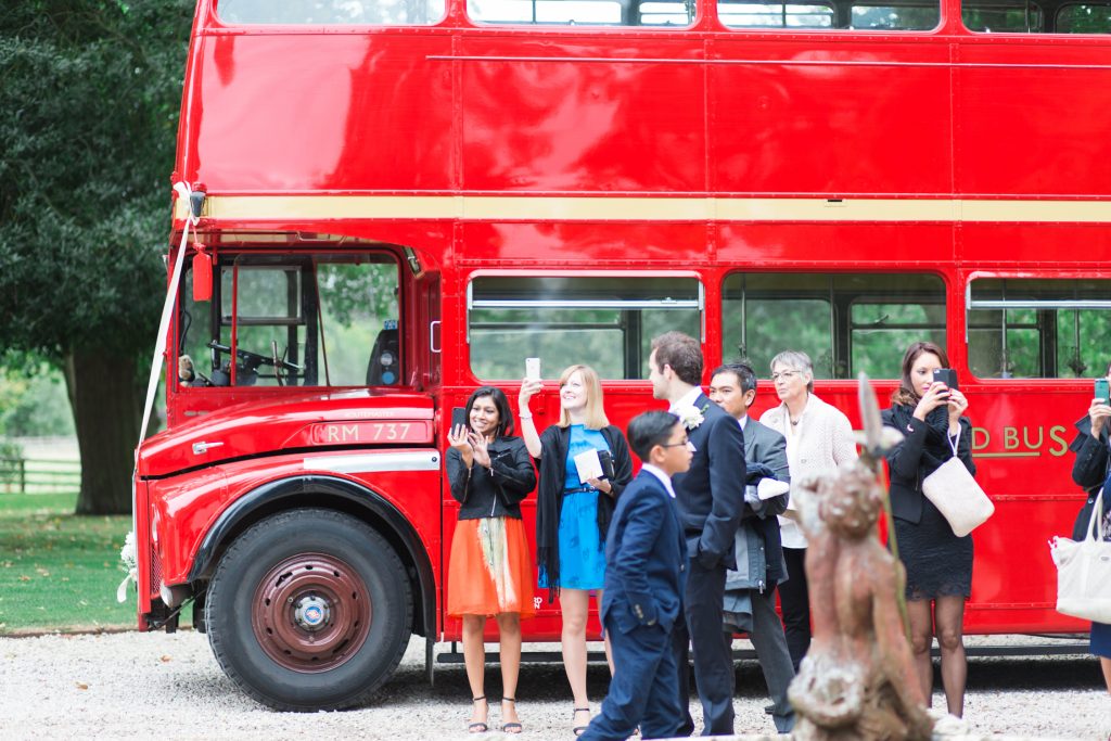 Red double decker wedding bus at Carlowrie Castle wedding venue