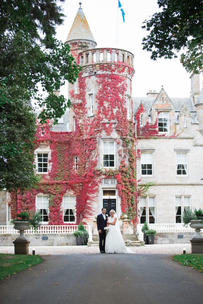 Carlowrie Castle Wedding in the autumn with an elegant bride wearing Caroline Castigliano and groom wears Hugo Boss