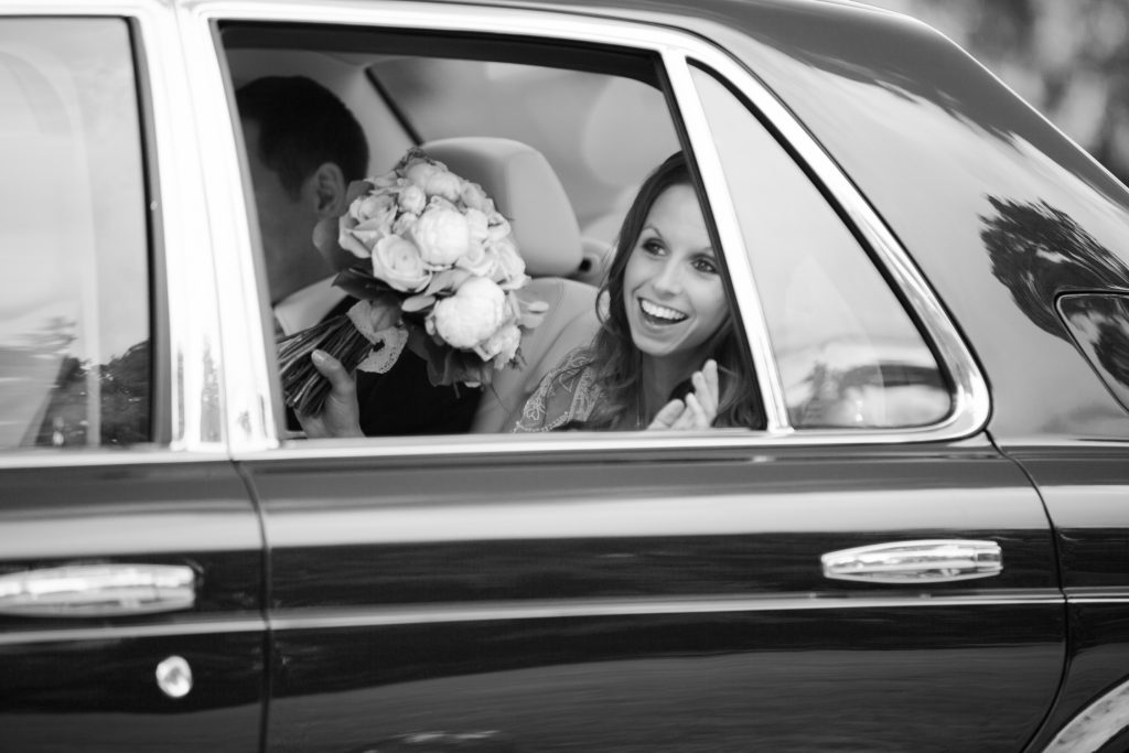 Bride arrives at Dorfold Hall in wedding car photo