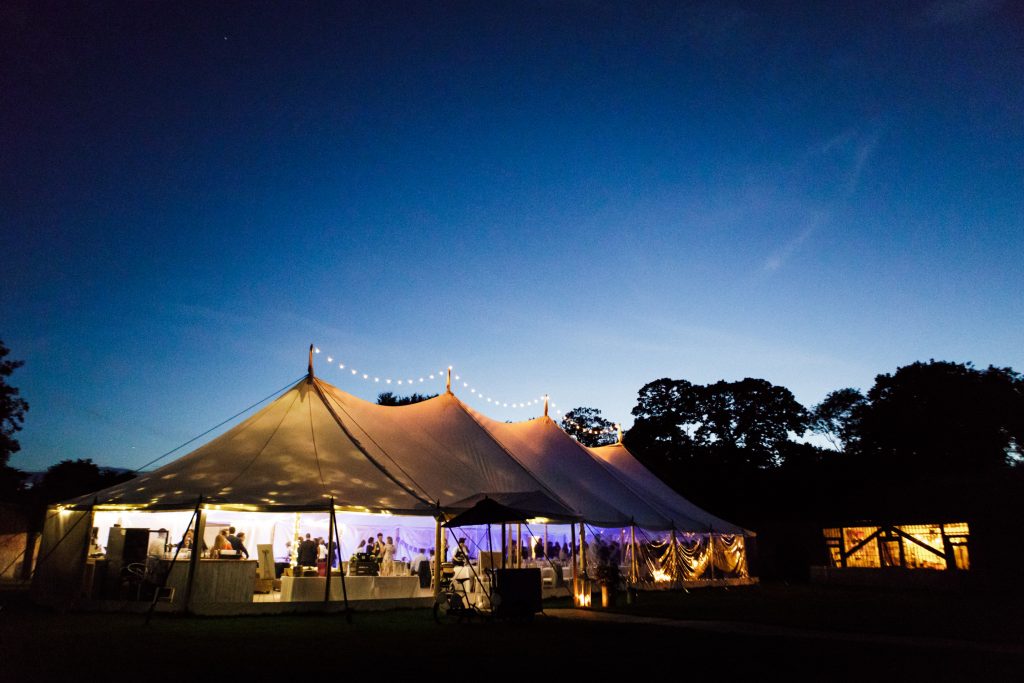 Sperry tent at Dorfold Hall at dusk for a Cheshire wedding photo