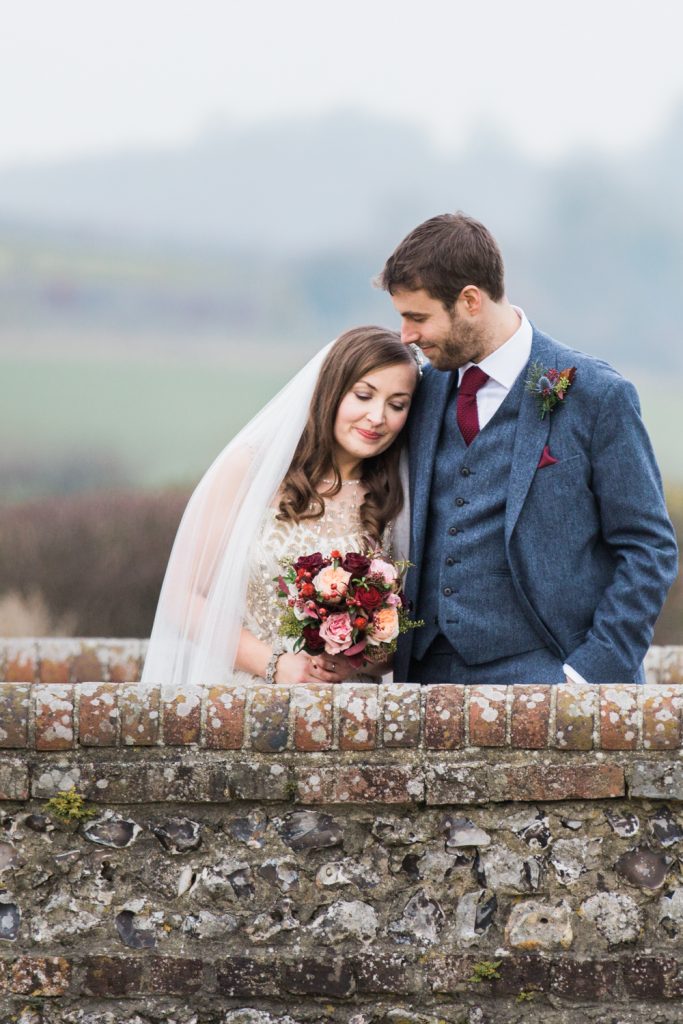 Portraits of bride and groom for a winter wedding at Farbridge Barns. Fine art Wedding Photography in the UK.
