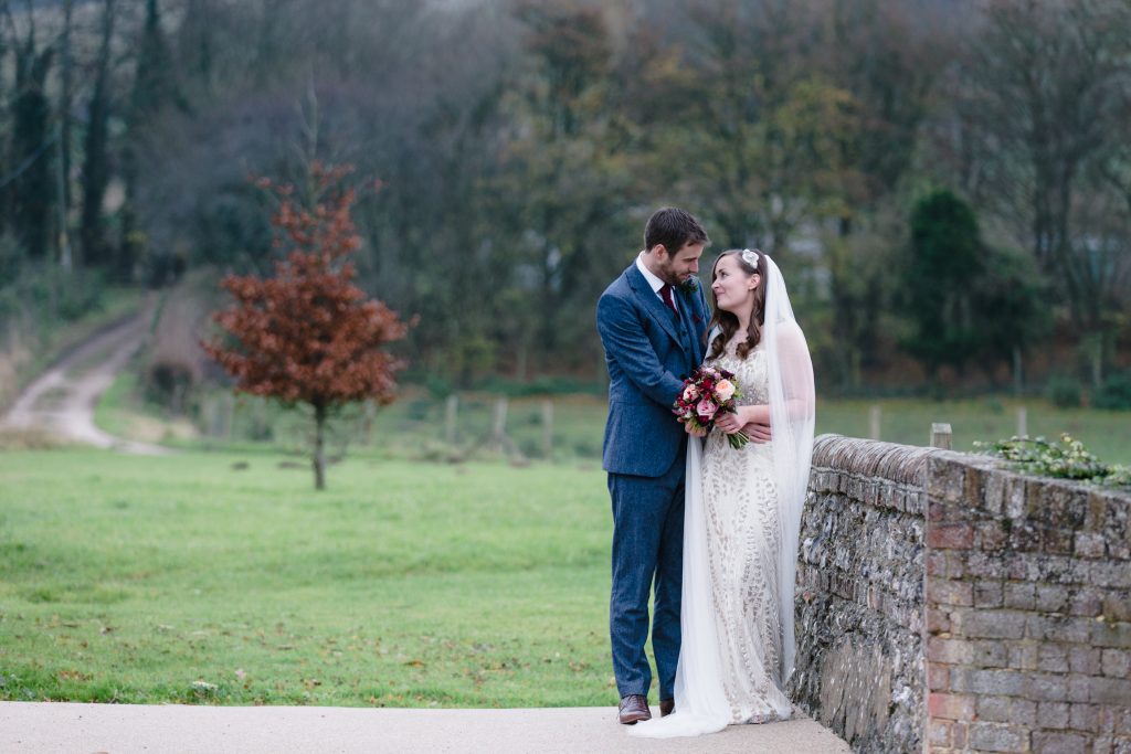 Portraits of bride and groom for a winter wedding at Farbridge Barns. Fine art Wedding Photography in the UK.