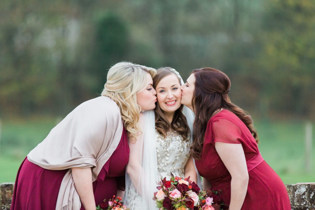 Winter bridesmaid inspiration with bride with bridesmaids at a winter barn wedding photo