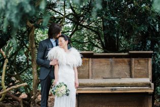 Spring wedding at Iscoyd Park featuring bride and groom photos by the piano in the gardens.