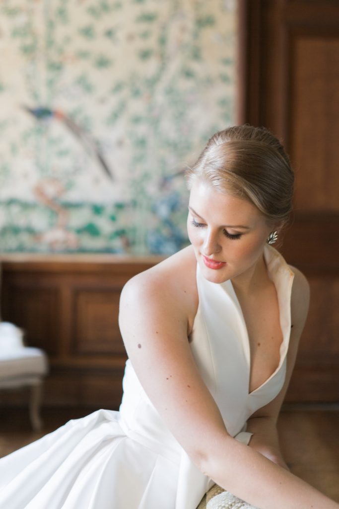 Grace Kelly inspiration for stylish bride wearing Jesus Peiro wedding gown with bow. From editorial inspiration shoot by UK fine art wedding photographer Jade Osborne.