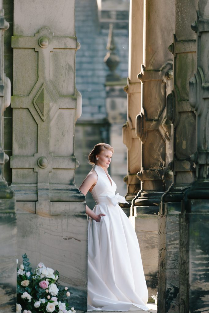 Bride at the door of Sandon Hall, wedding venue in Staffordshire for this bridal inspiration shoot featuring a Jesus Peiro wedding gown. Photography by Jade Osborne Fine art wedding photographer.