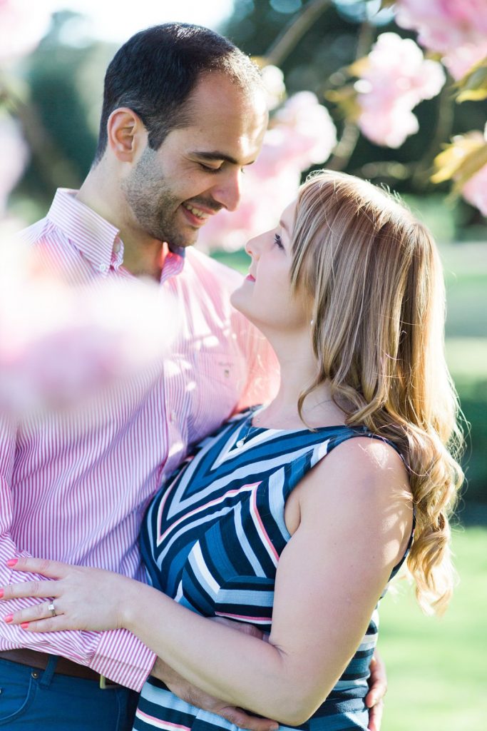 Springtime engagement shoot with tree blossom photo