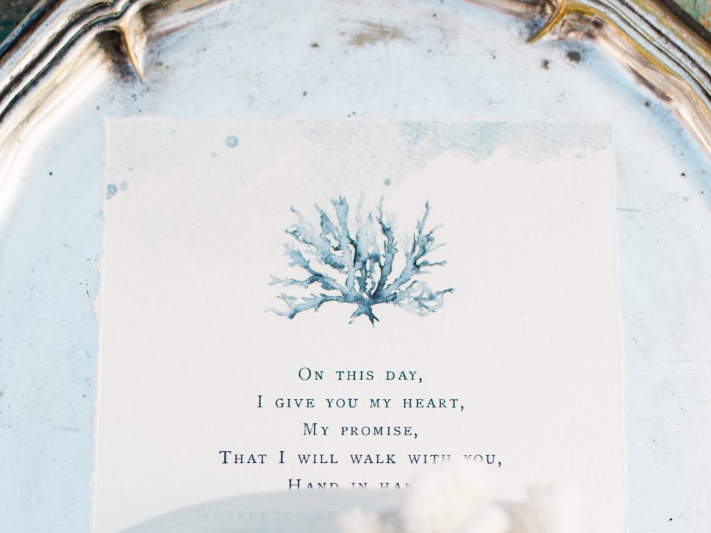 Blue and white calligraphy wedding stationery for a Santorini wedding photo