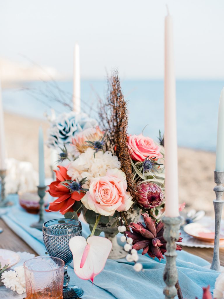 Coral florals for a beach wedding by UK Fine Art Wedding Photographer