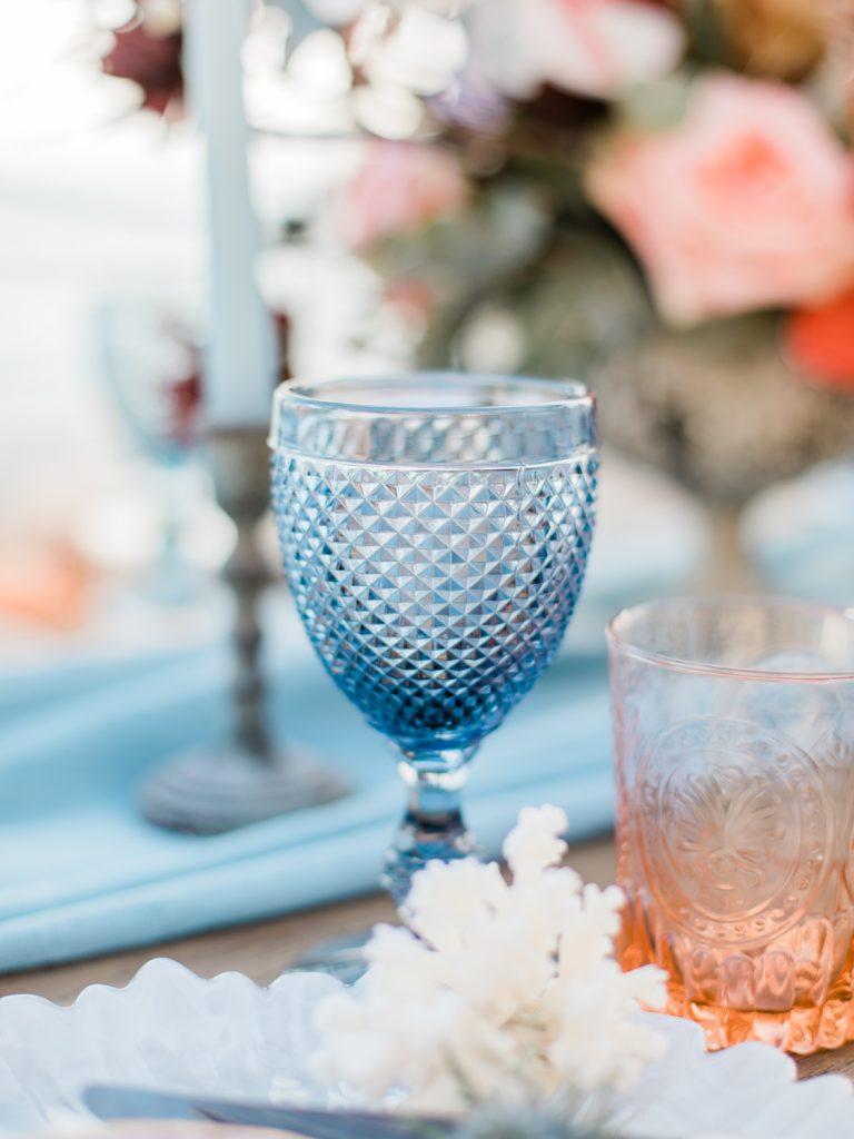 UK Fine Art Wedding Photographer featuring table details set up for a beach wedding in Santorini