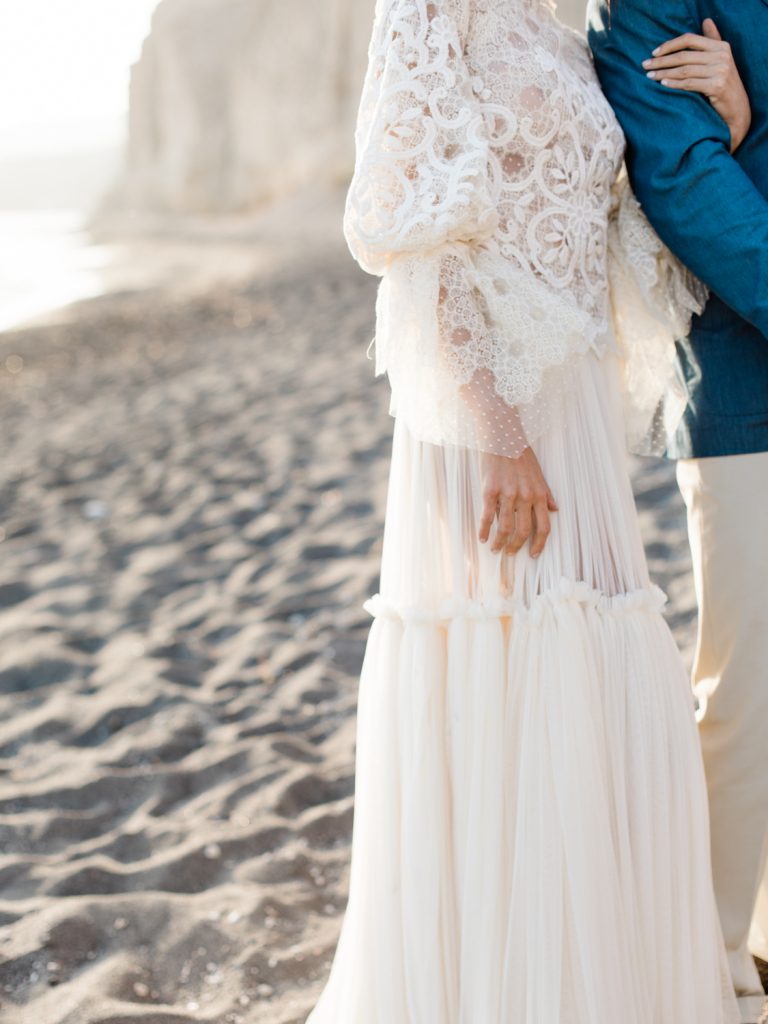Bride in lace dress for beach wedding in Santorini