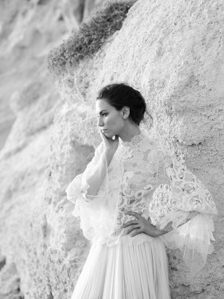 Fine are wedding photographer featuring bride in lace wedding dress from Christos Costarellos