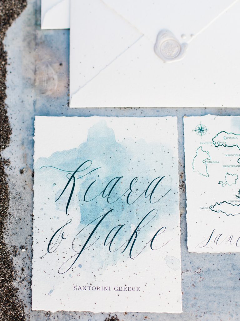 Stationery for a beach wedding in Santorini featuring white and blue watercolour