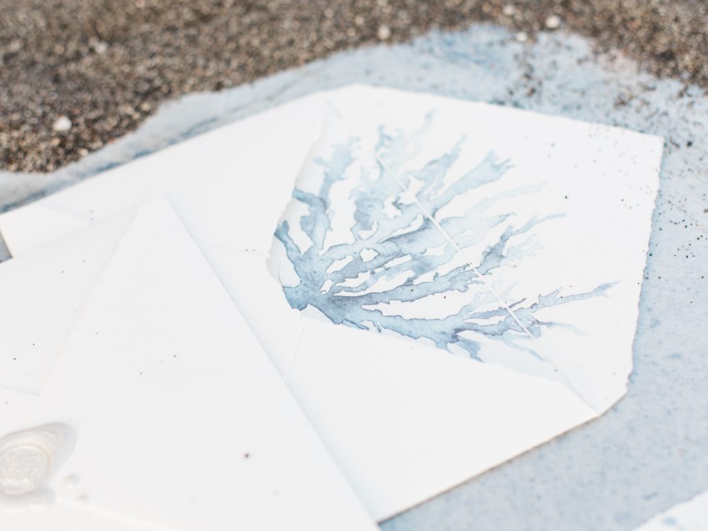 Stationery for a beach wedding in Santorini featuring white and blue watercolour