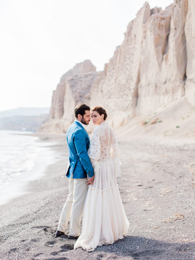 Bride and groom wedding photographs for a beach wedding by UK Fine Art Wedding Photographer