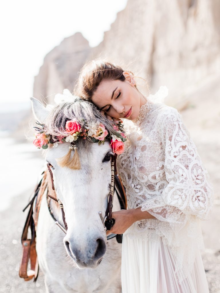Bridal portrait by Cheshire based wedding photographer featuring beach wedding in Santorini