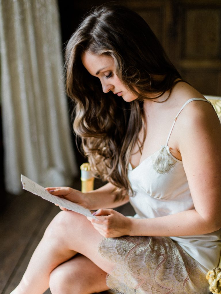 Bridal preparatrion at Dorfold Hall. Bride wearing Shell Belle Couture ivory lace and gold slip.