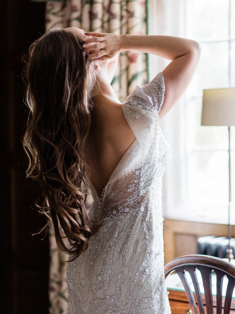 Bridal preparation at Dorfold Hall in Cheshire. Bride is wearing a Jenny Packham Bridal Gown, Nashville.