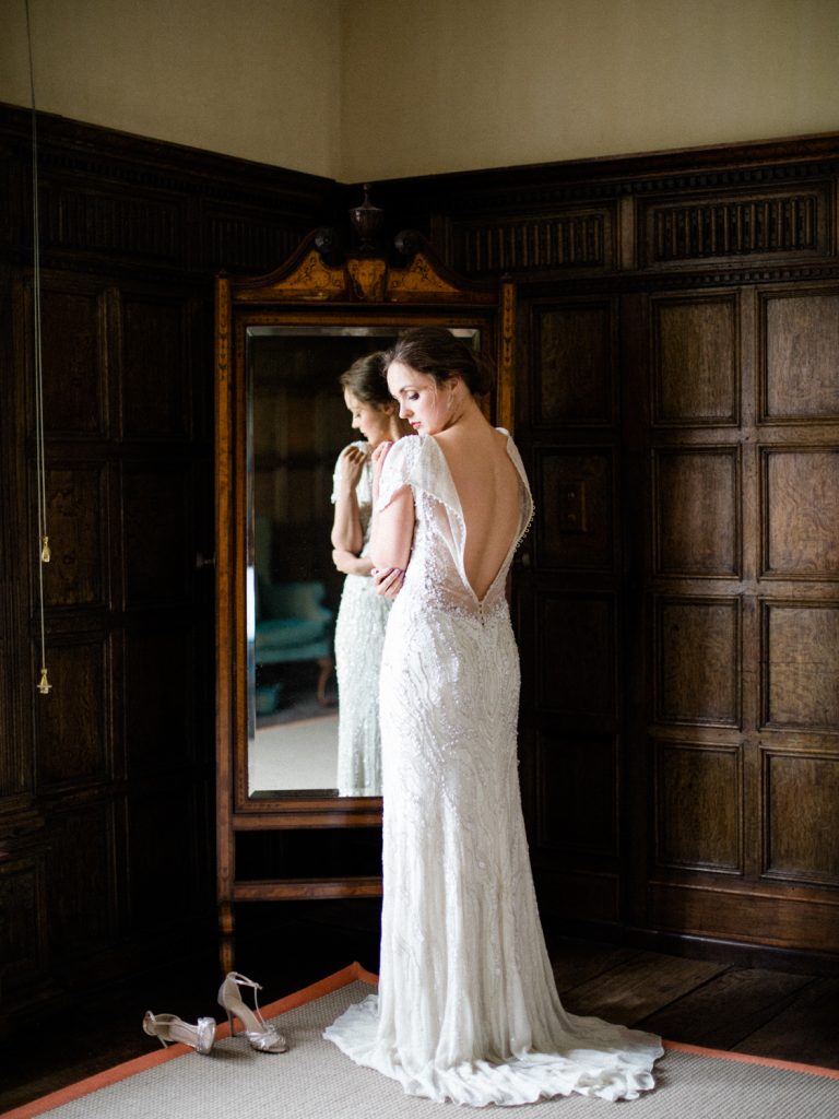 Bride getting ready at Dorfold Hall featuring Jenny Packham gown for an intimate wedding.