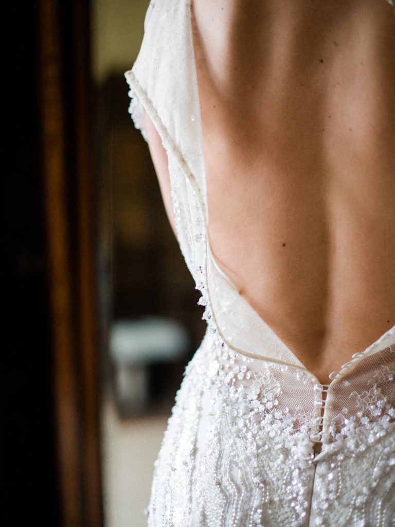 Bride getting ready at Dorfold Hall featuring Jenny Packham gown for an intimate wedding.