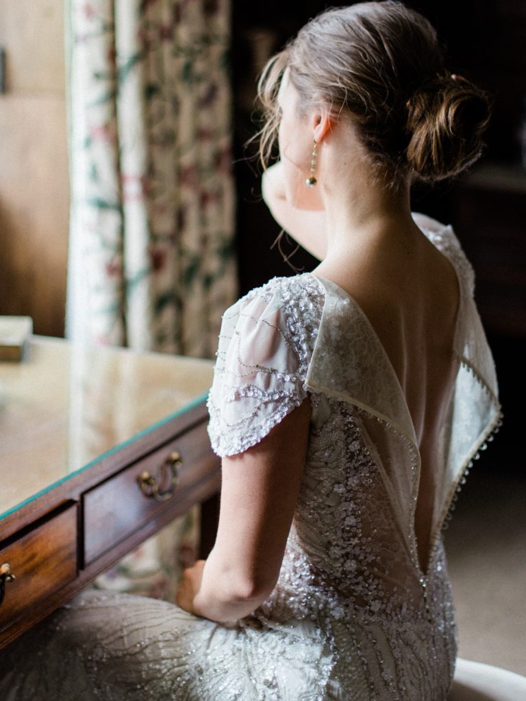 Bridal preparation featuring bride in Jenny Packham bridal for an elegant and intimate inspiration shoot at Dorfold Hall wedding venue in Cheshire