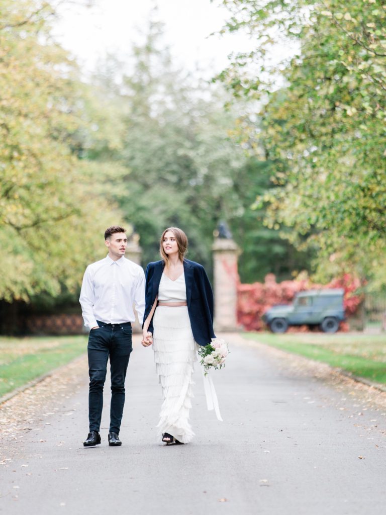 Driveway at Dorfold Hall with bride and groom.