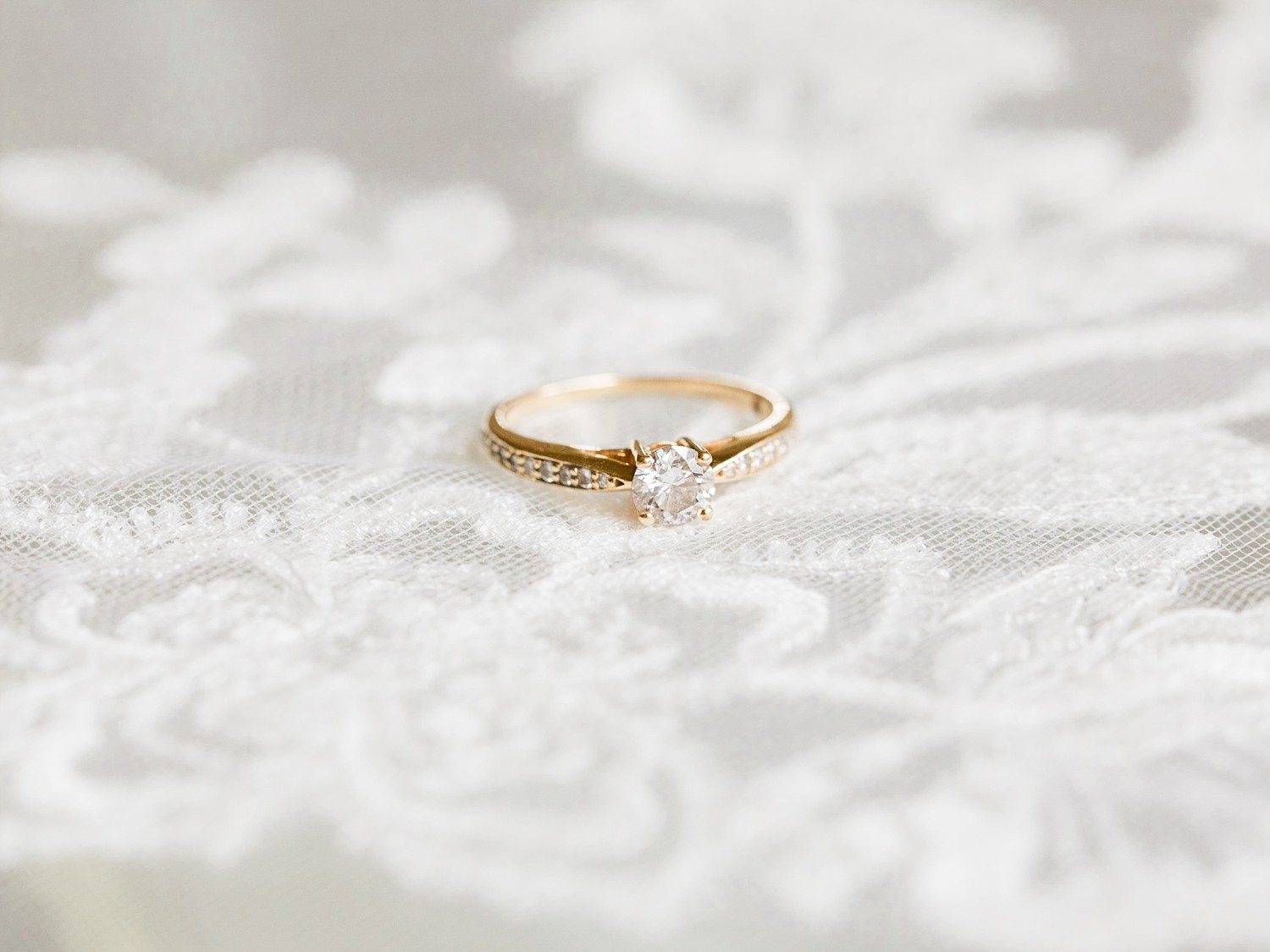 Gold and diamond engagement ring by Fine Art Wedding Photographer based in the UK