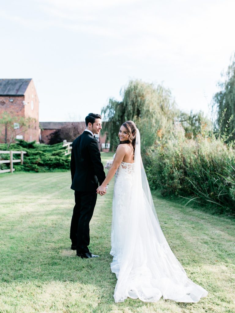 Bride wears an Enzoani gown from Along Came Eve in Chester - photo