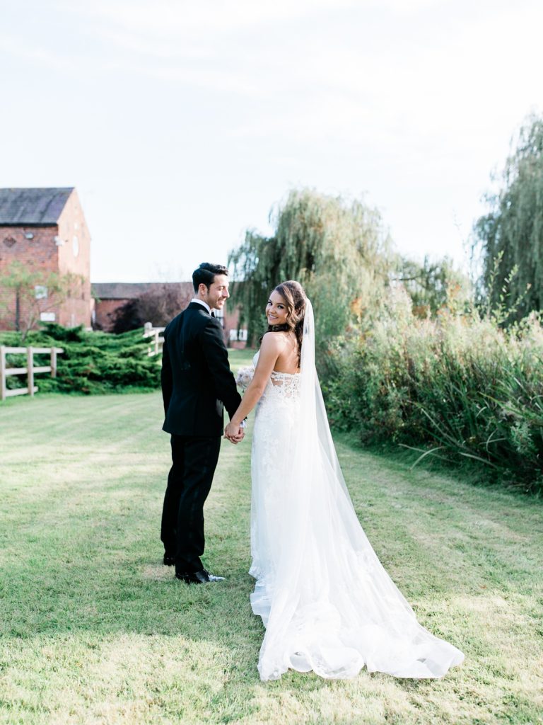Bride wears an Enzoani gown from Along Came Eve in Chester - photo