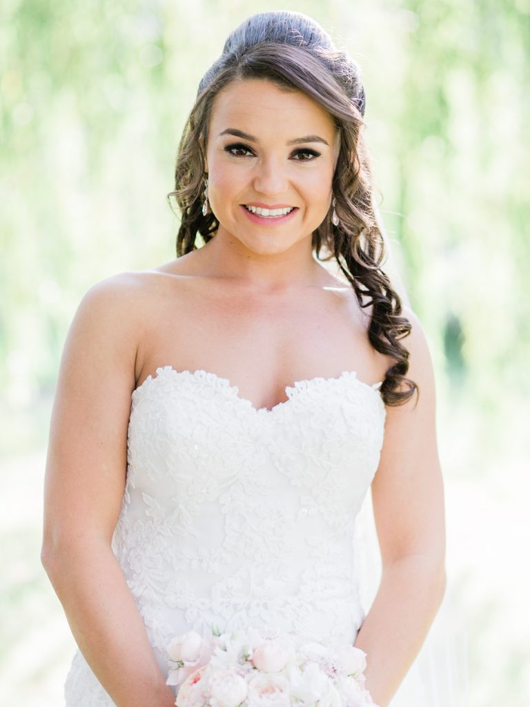 Bride wears an Enzoani gown from Along Came Eve in Chester - photo