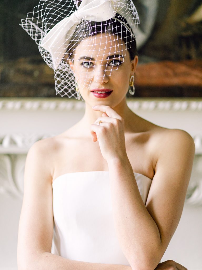 Bride wearing a birdcage veil by Awon Golding.