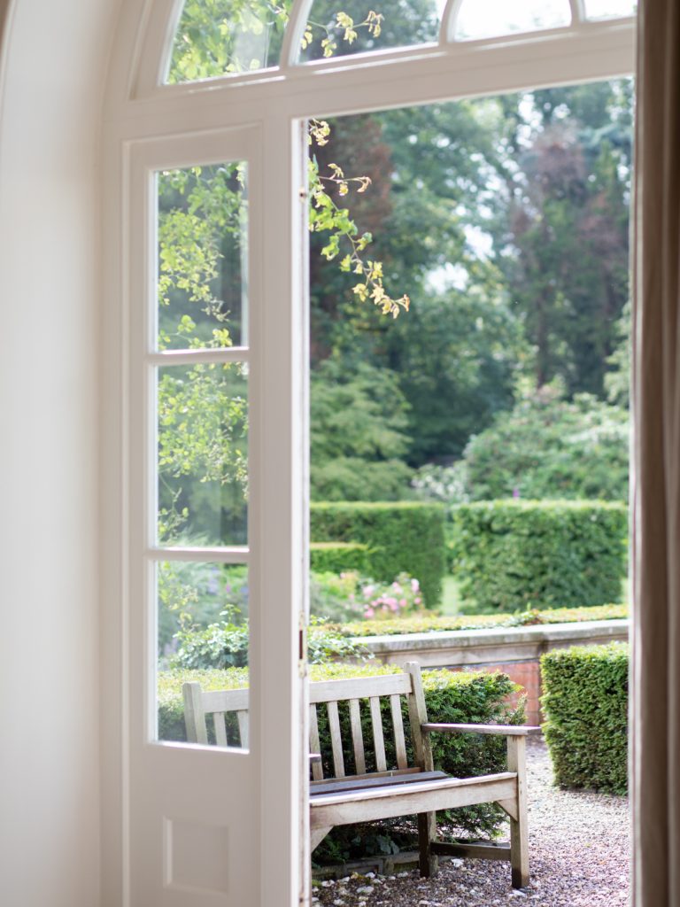 Venue detail shot looking through some glass doors into the gardens.