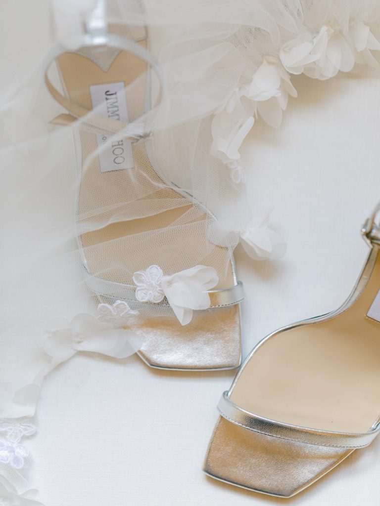 Metallic silver strappy bridal shoes and bride Erin's tulle veil
