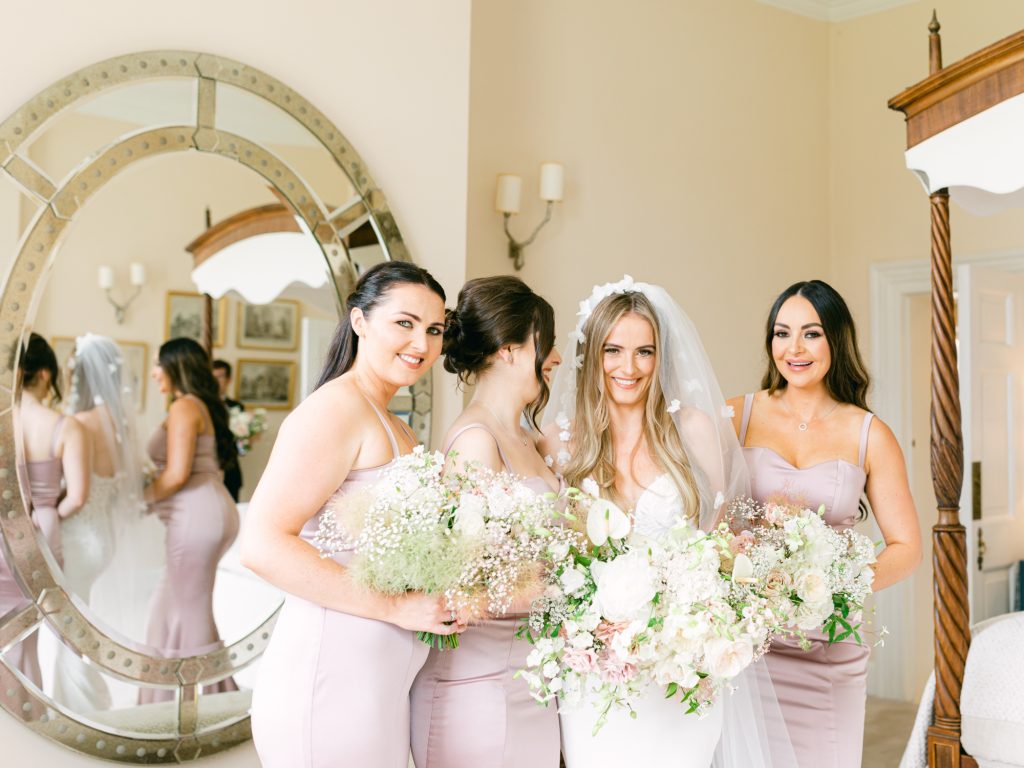 Bride Erin and her bridesmaid's having a photo together in the Honeymoon Suite before the ceremony.