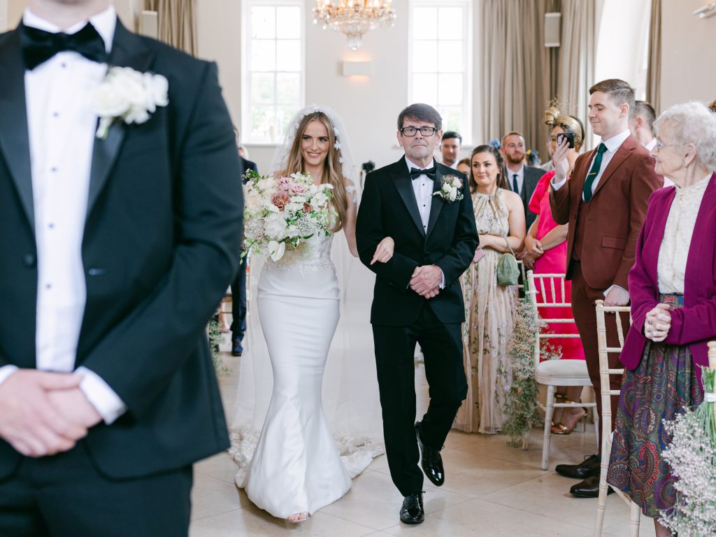 Bride Erin and her father walking down the aisle to Into the Mystic by Van Morrison.