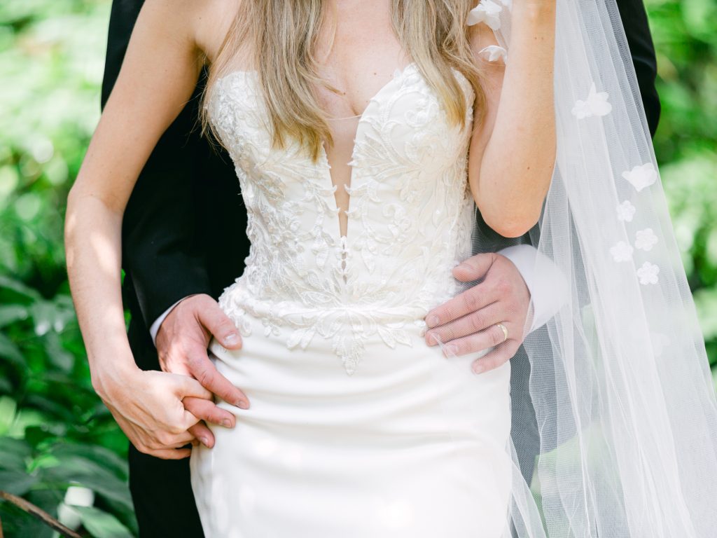 Bride and groom posing in the gardens at Iscoyd Park.
