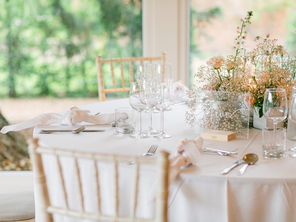 Wedding breakfast set up at Iscoyd Park, elegant florals and a neutral colour palette.