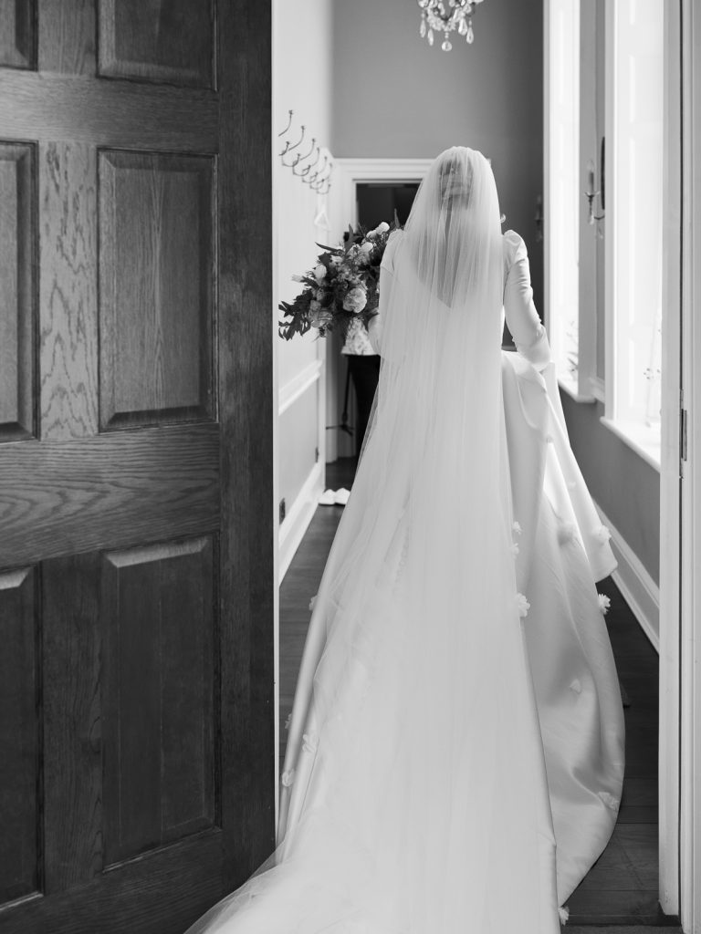 Black and white capture of bride Jessica heading to the wedding ceremony.