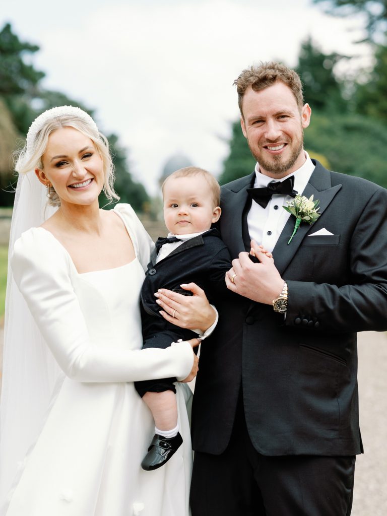 Jess and Lewis having a family photo with their small son