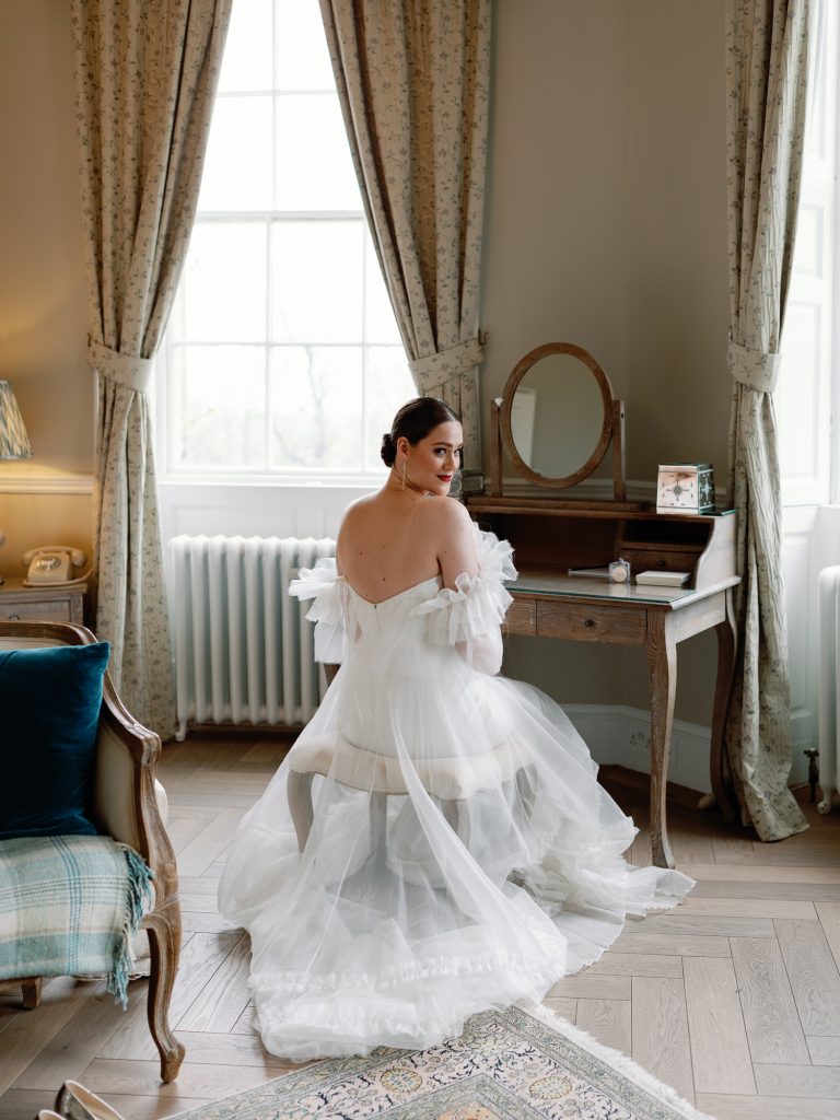 Bride Else in her Halfpenny London wedding dress in the Honeymoon Suite at Middleton Lodge.