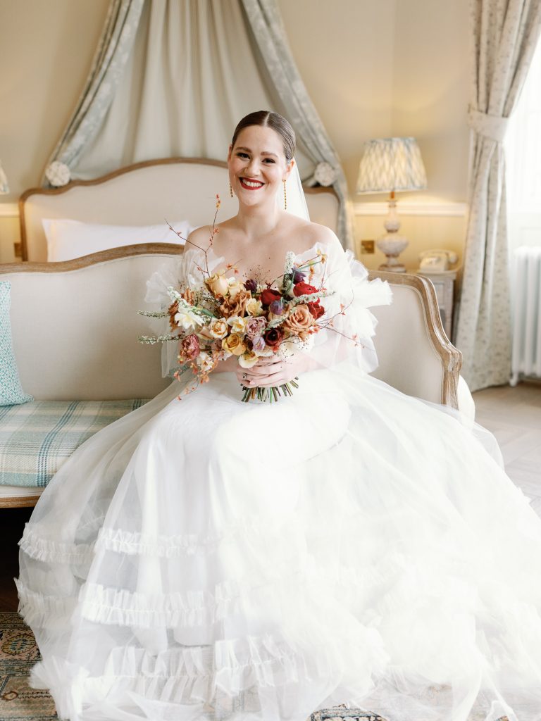Bride Else ready to get married in her Halfpenny London wedding dress and warm bridal bouquet.