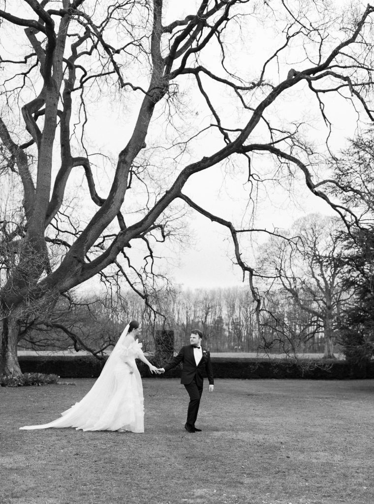 Else and Rory walking across the lawn together, captured in black and white.