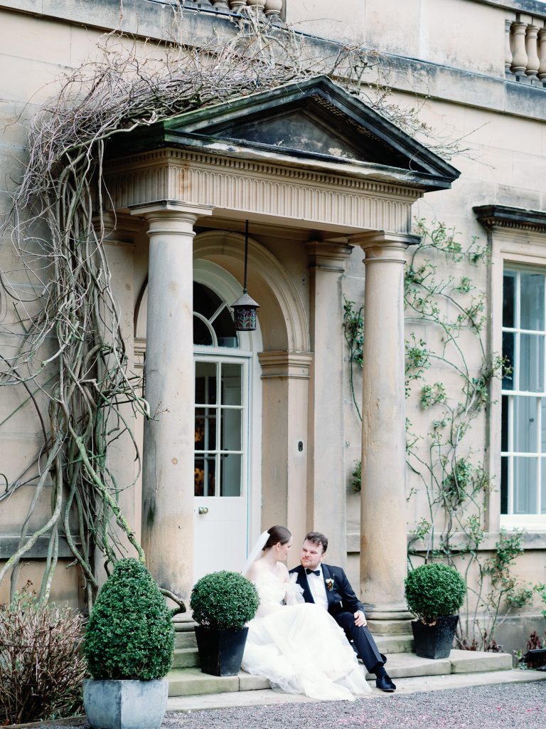 Else and Rory enjoying a quiet moment together sitting on the steps outside the Main House at Middleton Lodge.