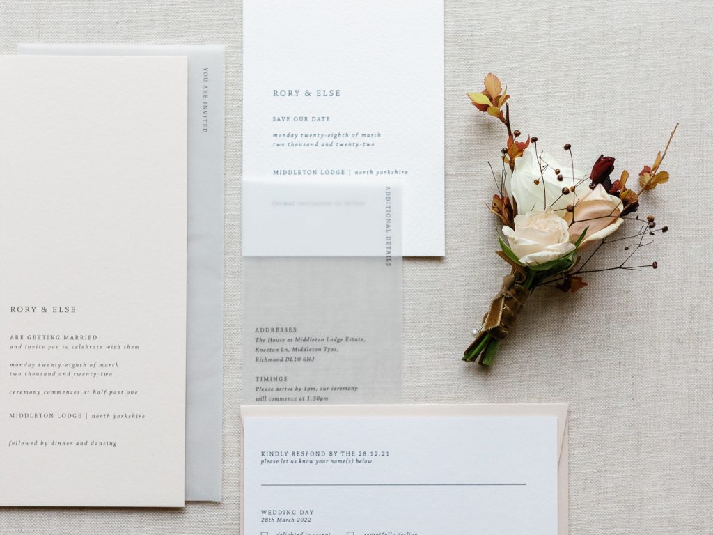 Elegant, simple wedding stationery suite and groom's buttonhole.