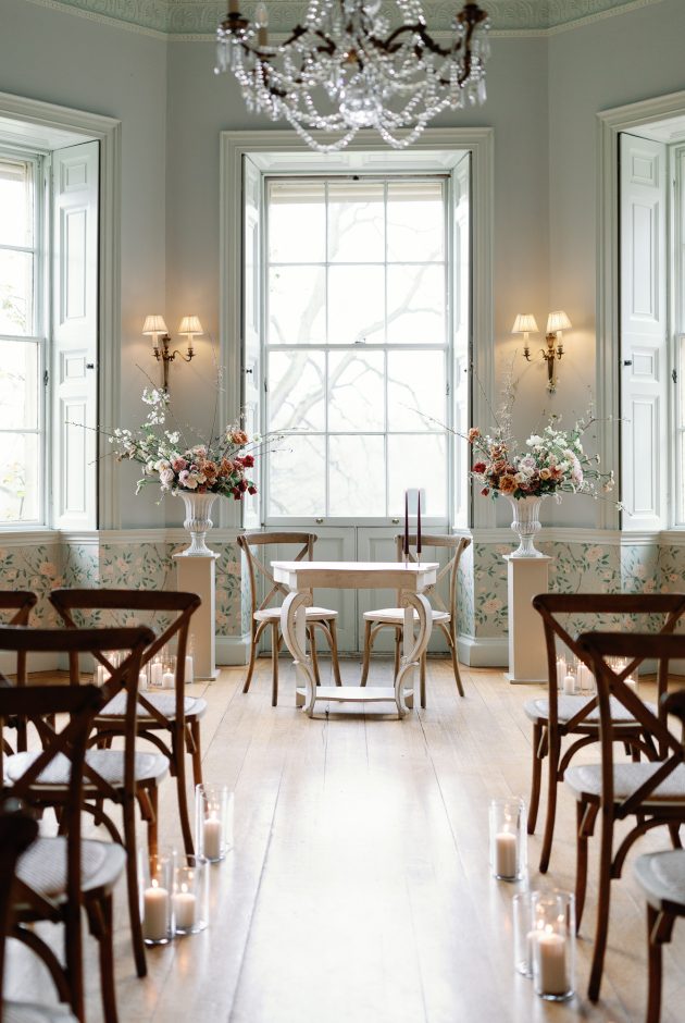 The ceremony set up at the Main House at Middleton Lodge. Including two floral urn installations either side of the aisle.